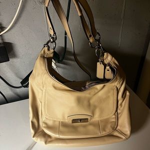 Cream Coach shoulder bag with crossbody strap